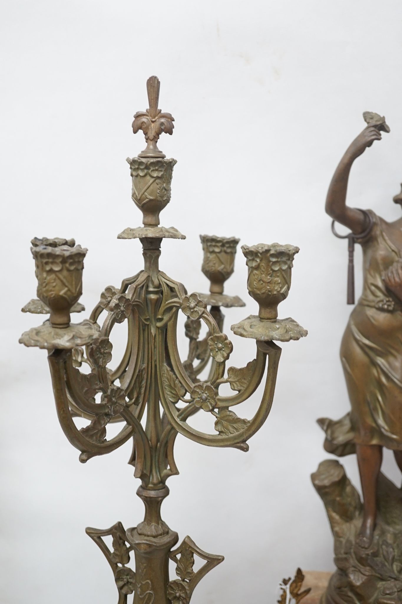 A French onyx and spelter figural clock garniture 66cm